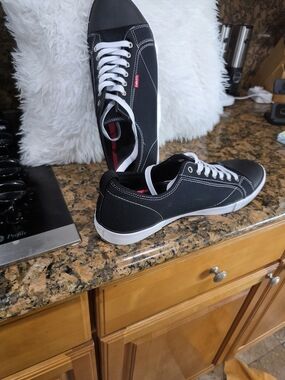 Levi's Men's Black Canvas Low-Top Sneakers with White Accents and Red Tab
